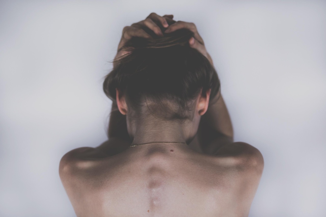 woman sad depression skin headache 2609115